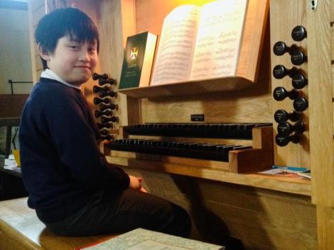 John Zhang at an organ aged 11