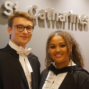 Two students at St Catharine's College in academic dress