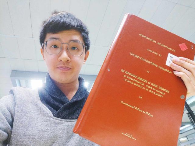 Chee Yong Tan with the original 1956 memorandum submitted to the Reid Commission