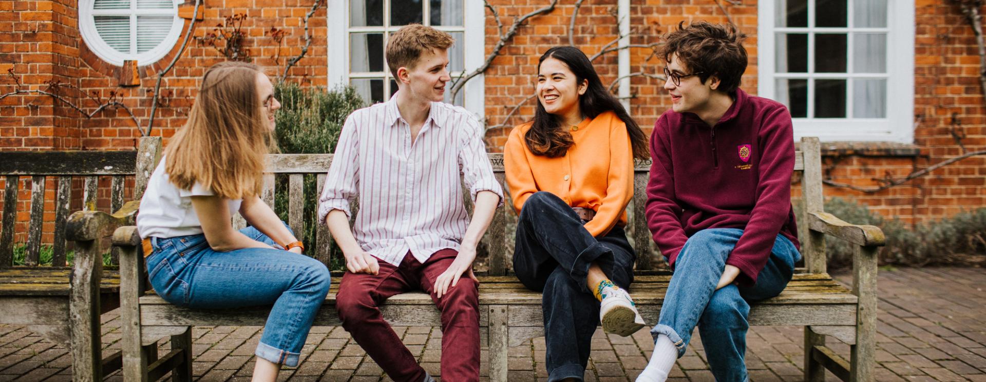 Group of St Catharine's student on a bench