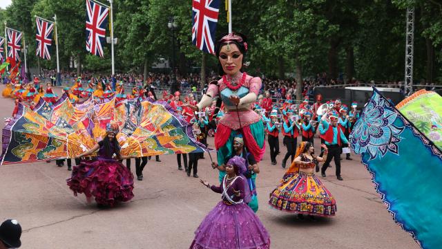 The carnival-inspired portion of the Jubilee Pageant moves down the Mall
