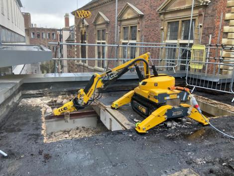 Robot demolishing roof of the College's old Hall