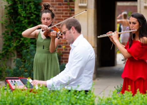 Group of musicians in the College gardens