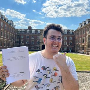 Kit Treadwell with his MPhil dissertation at St Catharine's College