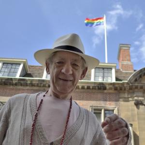 Sir Ian McKellen at St Catharine's College with the Rainbow Flag flying