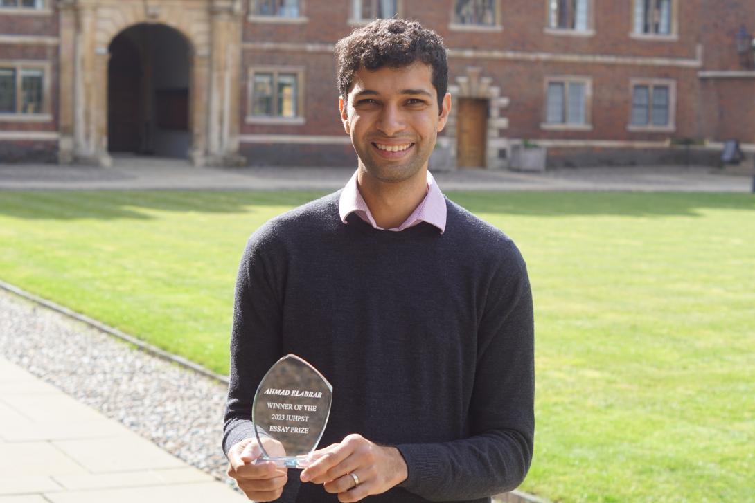 Ahmad Elabbar with trophy for IUHPST Essay Prize in History and Philosophy of Science 2023
