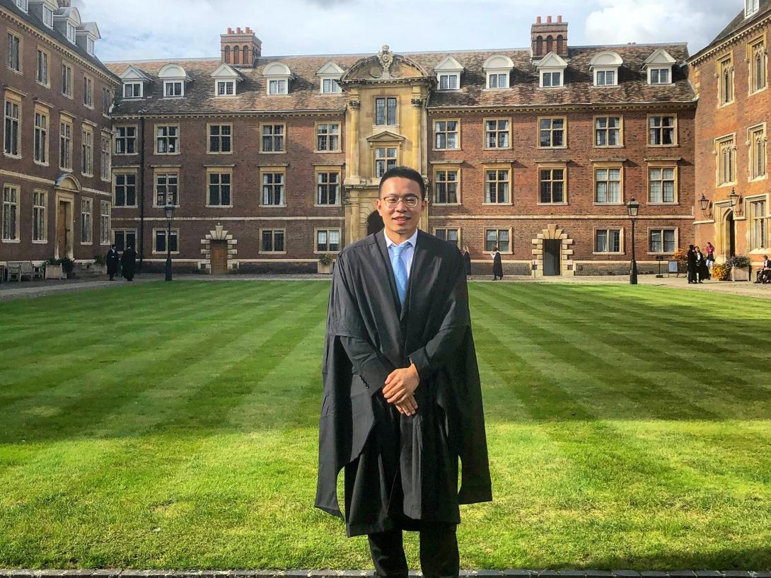 Yajie Zhao in academic dress in the Main Court of St Catharine's College